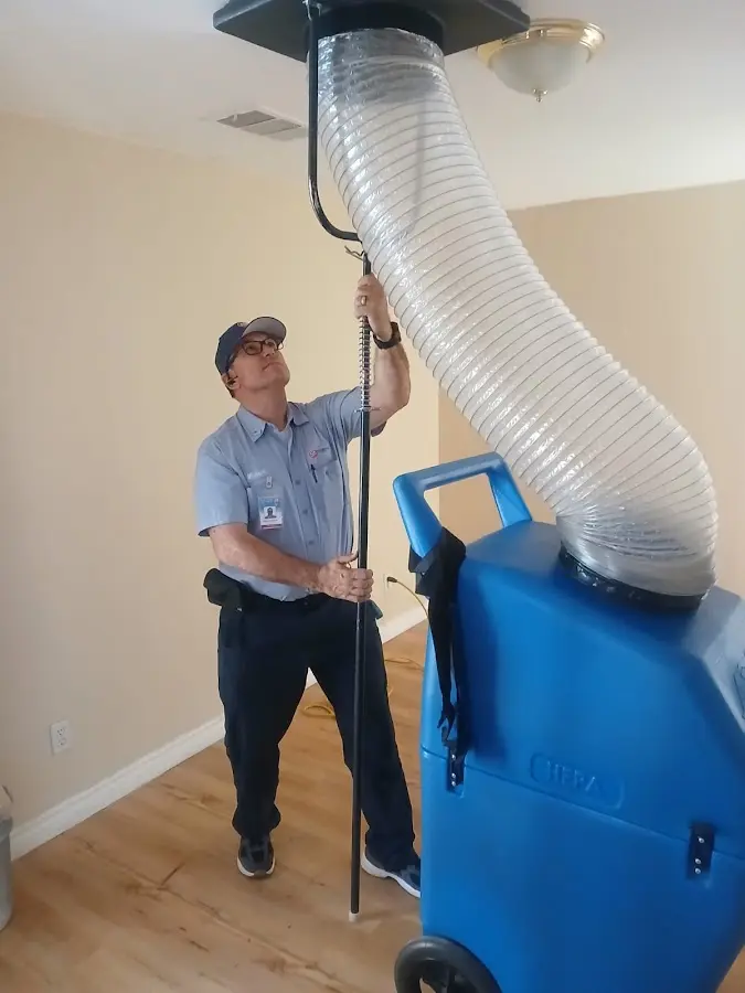 Furnace Tune-Up technician using HEPA equipment in Wixom